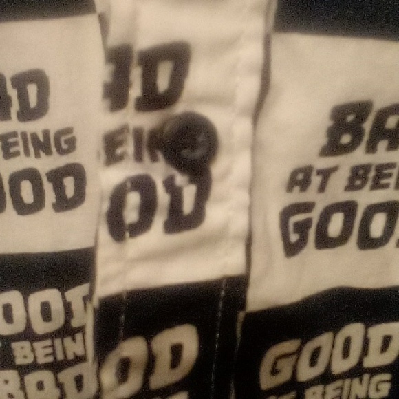 Button down tee shirt with collar and slits on eac side saying bad at being good - Picture 7 of 7